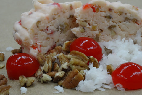 This beautiful white chocolate fudge has an amazing coconut flavor.  We paired it with chopped up cherries, pecans and toasted coconut. It is one of our kitchen staffs favorites.